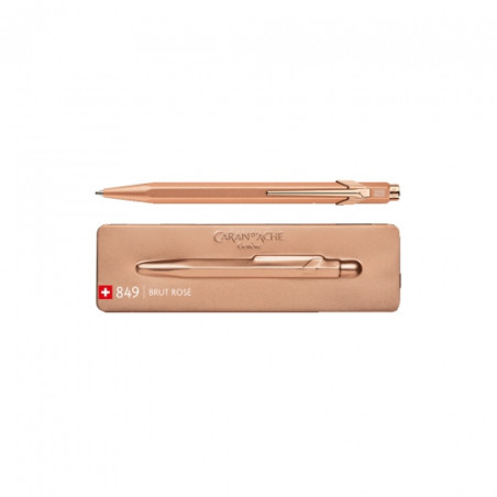 Caran'dAche 849 roller ballpoint pen in a brut rose case
