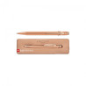 Caran'dAche 849 roller ballpoint pen in a brut rose case